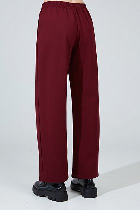 Фото модной одежды - монро брюки трикотаж бордовый сезон 2020 года